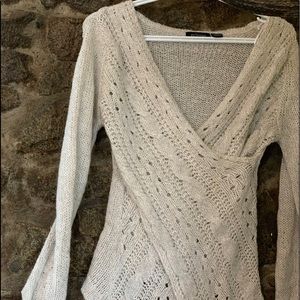 Very elegant sweater. Crossed style